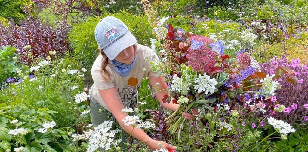 Mendocino Coast Botanical Gardens — Visitor Creating a Garden Bouquet