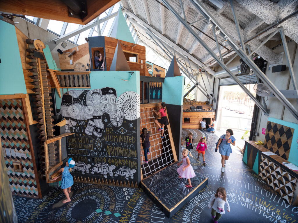 Children exploring an indoor play installation at The New Children’s Museum.